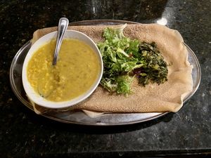 Kik Alicha with collards. Also comes with a side of injera.  at Demera in Chicago