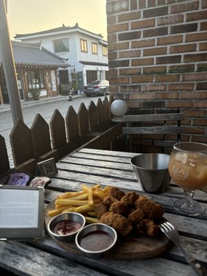 Vegan chicken nuggets. Comes with chips and sauces. Plus 100% organic apple juice    at Nomadic Brewing Cafe - 노매딕 브루잉 카페 in Jeonju
