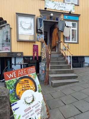 Exterior, with some outdoor seating on the other side of the building at Mama  in Reykjavik