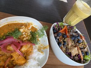 Potato and chickpea dish with a delicious salad and excellent banana,coconut, turmeric and ginger smoothie with oat milk at Mama  in Reykjavik