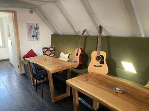 The upstairs area with guitars available for use at Mama  in Reykjavik