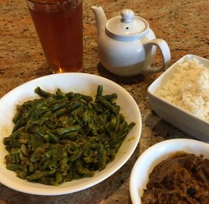 Bonchi Curry. A popular & traditional Sri Lankan dish. Spicy green bean curry cooked in coconut milk, served with rice. Very good and filling. Side of eggplant. at House of Curry in Rosemount
