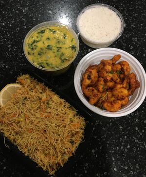 Friday night take-out! From the bottom: Vegetable noodles without egg; Dhal and Spinach Curry; Rice; Spicy Cauliflower. All vegan, all outstanding. at House of Curry in Rosemount