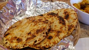 Pol roti ($15). Thick griddle cakes. Nicely savory. at House of Curry in Rosemount