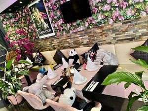 Sit inside in our pink and green settings  at The Vegan Indian in Amsterdam