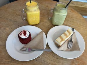 Delicious red velvet cake, salted caramel cheesecake and an iced matcha and turmeric latte. at Thrive in Cambridge