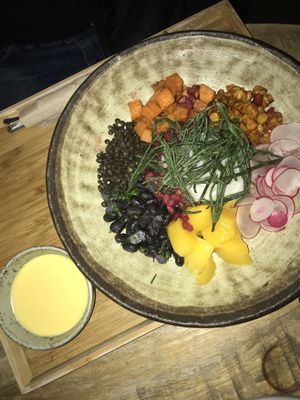 Burrito bowl: sweet potatoes, radish, rice, mango, corn, beans, pomegranate, coriander and maracuja dip at Brixton House in Bratislava