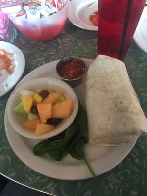 Vegan breakfast burrito with a side of fruit at 821 Cafe in Richmond