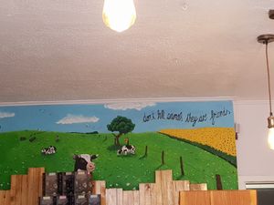 Kuhbild hinter der Theke at Erbse in Luebeck