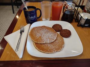 Really yummy vegan pancakes, vegan sausages, grapefruit juice, coffee, & oat milk at Arabella in Hendersonville