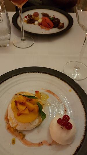 Aquafaba pavlova, peach from the market, pear sorbet at Le Courage in Maastricht