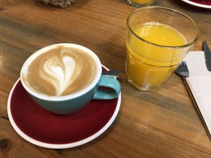 Cappuccino with oat milk and orange juice  at Brunch Corner in Valencia