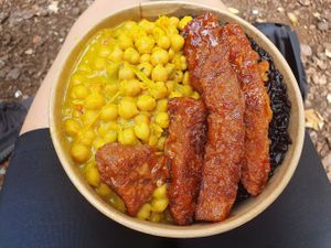 Chickpea curry with wheat meat and black rice. at Soul & Eden in West London