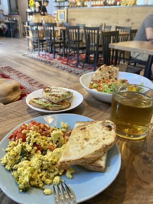 Tofu scramble (maybe just on weekends?), humble harissa avocado toast, Kamala masala, and licorice mint herbal tea   at Nirvana Tea House & Cafe in Millis