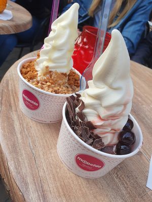 Soy froyo with biscoff cookie crumbs and nuts (peanuts) & the other one with cherries and dark chocolate at Moochie in Ghent