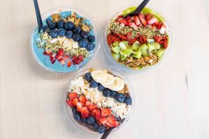 Smoothie bowls: blue, green, and acai in the front. bowls topped with granola, seasonal fruits, hemp hearts or chia seed, and a splash of organic agave nectar.  at Antiox in Hagerstown