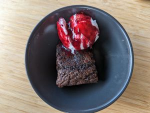 Brownie with coconut ice cream and berry sauce at The Cider House in Vancouver