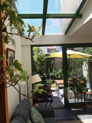 The atrium and garden of our apartment-b&b where you can enjoy breakfast or a drink. 
www.bnb-intermezzo.com at B&B InterMezzo in Antwerpen