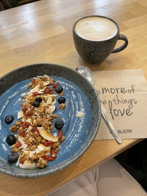 blue smoothie bowl & latte with almond milk at 42°Raw in Copenhagen