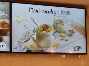 Screen advertising their vegan options: 'plantaardig lekker' at Panos in Bruges