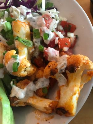 Buffalo cauliflower over rice/beans with avocado, salsa and coleslaw.   at Veg in Sarasota