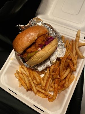 Buffalo chicken sandwich and seasoned fries 🍟  at Organic Food Kings in Miami