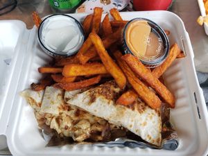 Chicken quesadilla. Huge portions and so delicious! I could only finish half. Don't miss the sweet potato fries with marshmallows dipping sauce. You won't find that anywhere else!  at Organic Food Kings in Miami