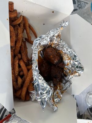 Yummy buffalo wings with sweet potato fries with delish marshmallow sauce   at Organic Food Kings in Miami