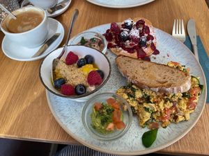 Emmi’s breakfast with extra pancake and flat white at Emmi's Kitchen - Werinherstr in Munich