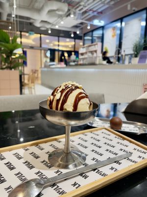 salted cashew ice cream with caramel sauce and nuts   at MYLK in Doha