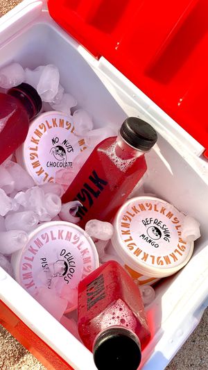 Ice cream tubs and cold drinks at MYLK in Doha