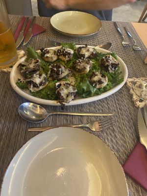 stuffed mushrooms with vegan cheese and tomatoes  at Gavino Restaurante Bar in Funchal