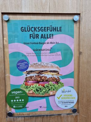 Outdoor sign for vegan burger at Hans im Glück in Trier