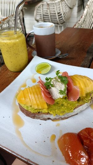 Mango madness smoothie, avocado toast (with roasted tomato) at Backyard Cafe - Street 240 in Phnom Penh