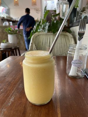 Tropical tonic smoothie (pineapple, turmeric root, coconut water), $3.75 (plus 10% tax)  at Backyard Cafe - Street 240 in Phnom Penh