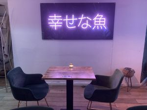 The sign says: happy fish at Vegan Sushi Bar - Downtown in Amsterdam