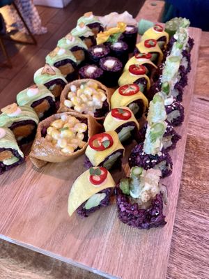 Miso glazed tofu maki, corn inari, sweet avocado tree, tropical mango and magic mushroom rolls  at Vegan Sushi Bar - Downtown in Amsterdam