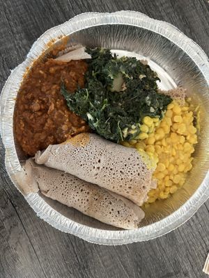 Vegan plate: Misir Wot (spiced red lentils), Gomen w/ Dinich (seasoned spinach), Kik Alicha (yellow split peas)  at Konjo Ethiopian Food in Edgewater
