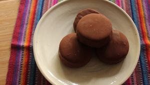 Alfajores  estilo Havana

Almond-based shortbread cookies with manjar blanco (dulce de leche) dipped in locally made bean to bar dark chocolate. Chocolate is all fair trade. at TUME in Orlando