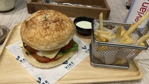 Vegan chicken burger with fries  at VIBE Coffee & Plant-Based Food in Bangkok