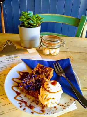vegan super flapjack with vegan ice cream & sauce at Daisy's  in Torquay