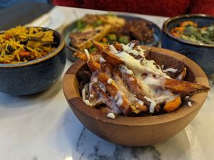 Vegan bacon bits on loaded cheezy sweet potato fries at The Vegan Brasserie in South West London