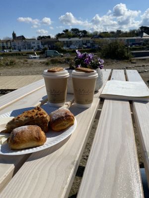 Salted caramel lattes, vegan Pain au Chocolat & Ginger Biscoff cake - yummy!!! Topped with lovely views   at Be Kind The Vegan Coffee Caravan in Hayle