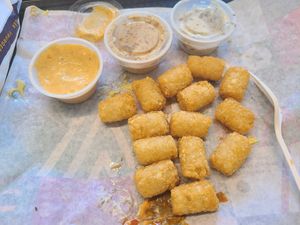 The breakfast tater totts were so crispy n delicious. I am glad. Taco bell's have beef fat so this is the place to get pure tatters. Yes to Signature dip. Garlic dip taste mustard  at V Burger in Calgary