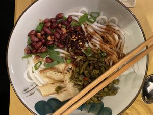 Rice noodles with seitan, peanuts, spicy sour beans  at Su Guan in Florence