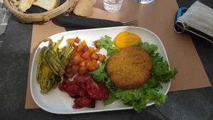 Vegan wiener schnitzel woth pumpkin and vegetables at Ciotolina Rivendita e Cucina in Cesenatico