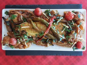 Calabaza cooked in charcoal, with okra and potato curry. at Spices in Frigiliana