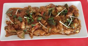 Fresh figs cooked ,onion ,tomato, with herbs souce. Vegen curry. at Spices in Frigiliana