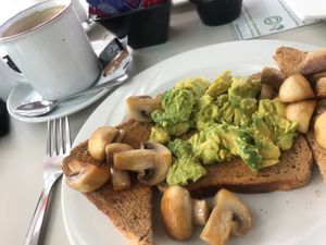 Breakfast - smashed avocado and mushrooms on toast at The Pool Bar in Nerja