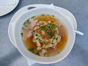 Vegetable broth with cheese dumpling at Velani in Vienna